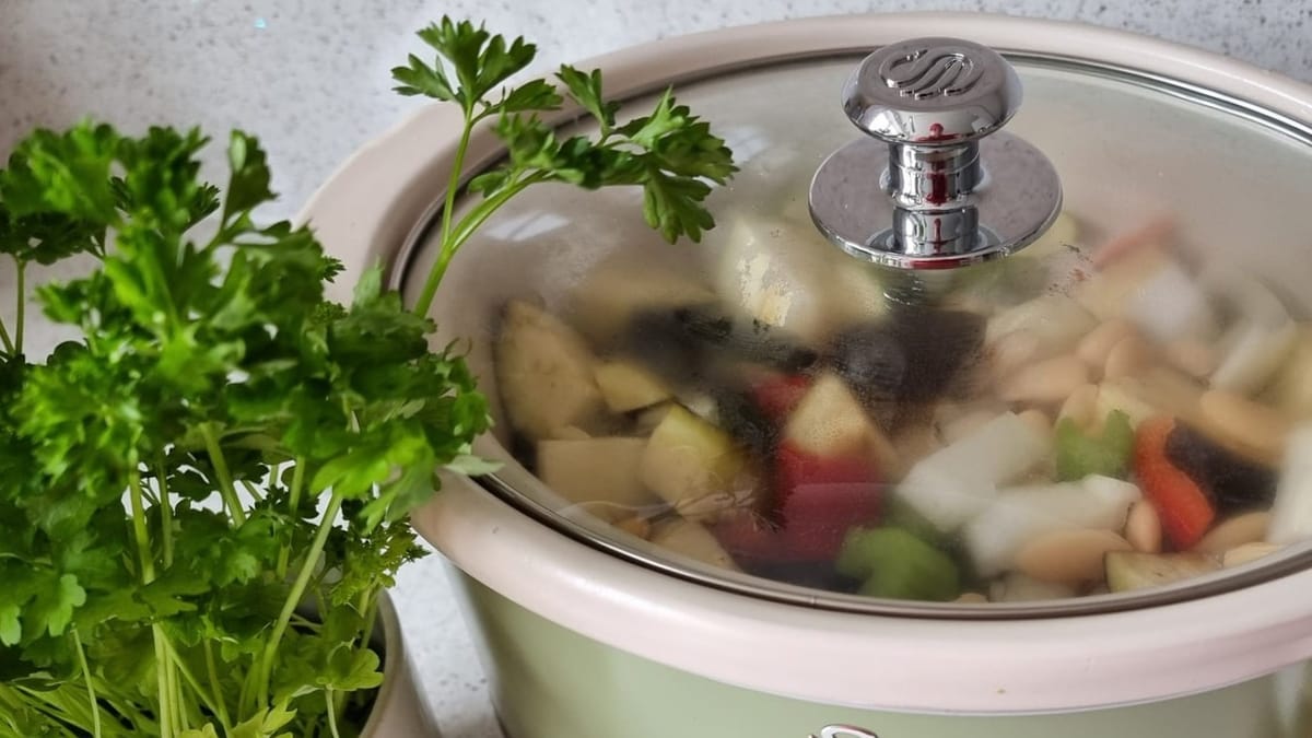 Can I open the lid of my slow cooker during cooking?